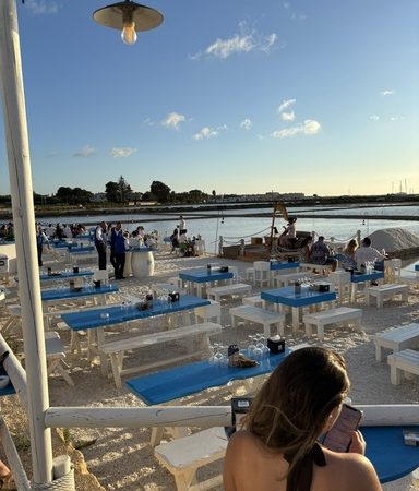 Day trip to Marsala Salt Pans with traditional windmills and reflective salt basins in Sicily